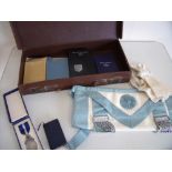 Brown leather Masonic case with contents including aprons, various Masonic booklets, tokens etc