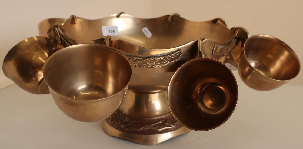 Indian brass punch bowl with eight hooked cups