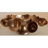 Indian brass punch bowl with eight hooked cups