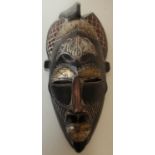 Carved wood African tribal face mask with brass metal mounts