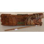 Unusual North American Native American carved wood slit drum carved with a figure of an eagle mask