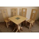 Unusual set of four puzzle style dining chairs and a matching table with glass insert