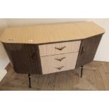 1960s laminate sideboard with three central drawers flanked by two cupboard doors, possible by