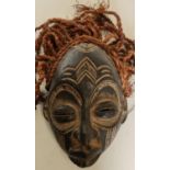 Carved African tribal style mask with hessian ropework hair