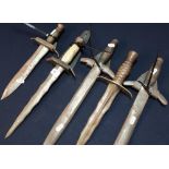 Selection of quality reproduction/re-enactment medieval style daggers of various forms, with wall