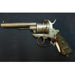 Belgium six shot pin-fire revolver with 4 1/2 inch octagonal barrel with carved grips depicting