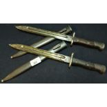 Two circa WWI bayonets with 9 1/2 inch blades with Indian style script, two piece wooden grips and