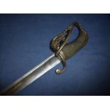 18th C Officers dress sword with 33 1/2 inch curved broad fullered blade with traces of engraved