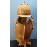 Reproduction steel riveted breast plate and a lobster tail style helmet, with wooden stand