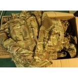 Four boxes containing a large quantity of various British military surplus uniform combats etc