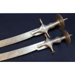 19th C Indian Talwar type sword with 31inch curved blade and a large disc shaped pommel, and another