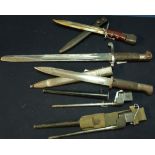 Group of five various assorted bayonets including two Lee Enfield spike bayonets, a German WWI
