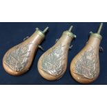 Three reproduction colt powder flasks