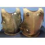Two steel reproduction breast plates with strap mounts