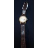 Military issue Moeris Wristwatch with secondary dial and leather strap, the back marked with