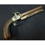 Percussion cap pistol with 4 inch octagonal Damascus barrel, steel stirrup ramrod and engraved