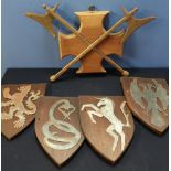 Set of four medieval style crested wall shields and a twin steel axe wall plaque