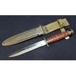 US M3 combat knife with 6 1/4 inch blade with part double edge stamped US M3 with shaped