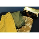 Selection of country related clothing including leggings, camoflagued top, various game carriers,