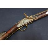 19th C flintlock carbine with 18 inch large bore barrel with fixed foresight, brass butt plate,