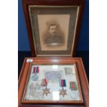 Framed and mounted display of a group of WWII medals comprising of 1939-1945 Star, Africa Star,