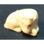 Edo period Japanese Netsuke of a buffalo at rest, signed to the base (approx 2.5cm high)