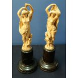 Pair of 19th/20th C French Dieppe carved ivory figures of semi clad maidens with cherubs at their