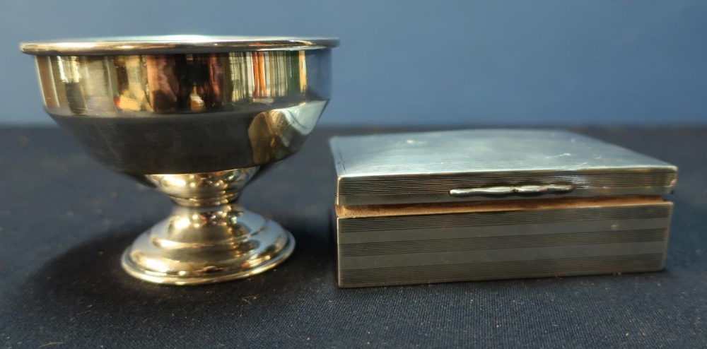 A Birmingham 1926 silver hallmarked rectangular cigarette box with lined interior and engine