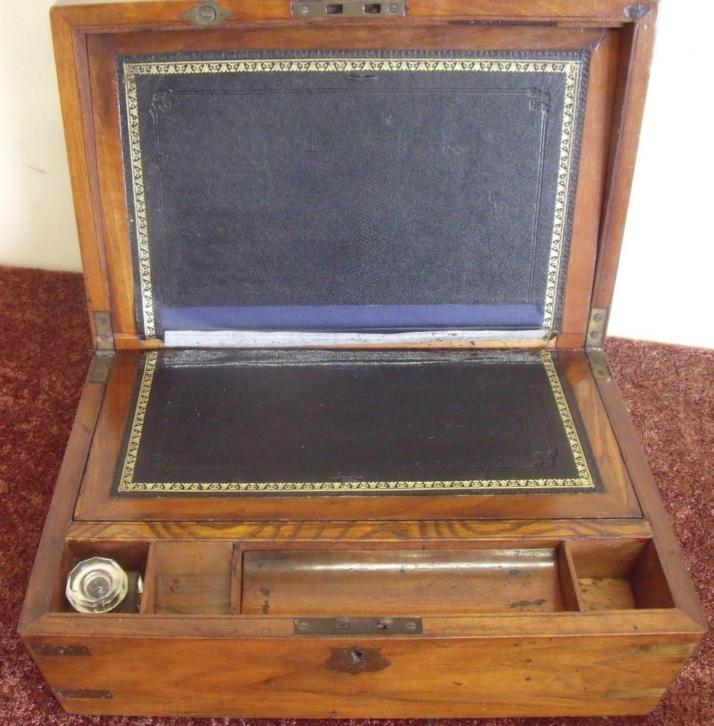 19th C walnut travelling writing box with hinged top revealing fitted interior, with brass mounts (