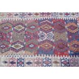 Middle Eastern Bedouin rug with geometric central pattern on beige ground (140cm x 95cm)