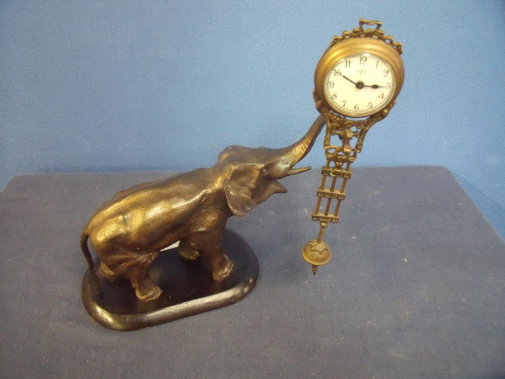 Unusual Mystique clock in the form of an elephant, on later added ebonised base (approx. 27cm high)
