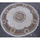 20th C circular Indian wool rug with central floral medallion, ivory ground and patterned border (