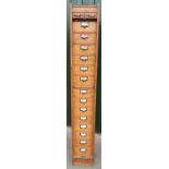 Edwardian golden oak 'Globe' office filing cabinet/bank of drawers enclosed by roller tambour door