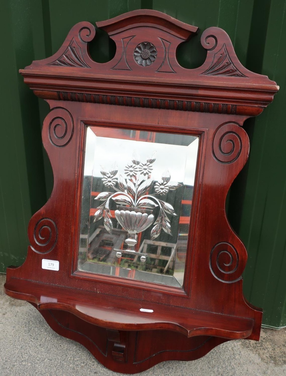 Late Victorian mahogany wall shelf with carved detail to the border and central etched glass bevel