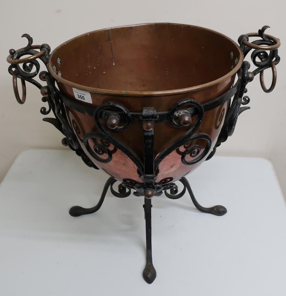 Unusual early 20th C copper jardinière in wrought metal frame (height 45cm)