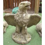 Large composite stone figure of an eagle with wings outspread, on oval base (height 83cm)