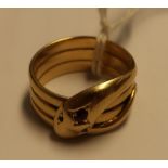Gents 18ct gold dress ring in the form of an entwined snake set with green stones for eyes and a