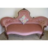 Victorian walnut framed three seat settee with upholstered seat and buttoned back, with carved