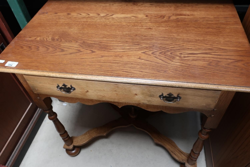 Quality craftsman's made light oak 18th C style lowboy with single draw on turned supports, X shaped
