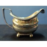 Early 19th C London silver hallmarked cream jug on bun feet with engraved detail (marks worn) (