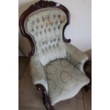 Victorian mahogany framed armchair with deep buttoned upholstered back