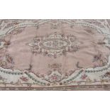 Traditional Indian wool rug, central floral medallion and floral pattern border (360cm x 267cm)