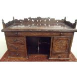 19th/20th C mahogany Oriental style table desk, the raised back and sides with carved fretwork