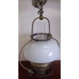 Late Victorian centre hanging brass oil lamp with opaque glass shade and embossed reservoir, with