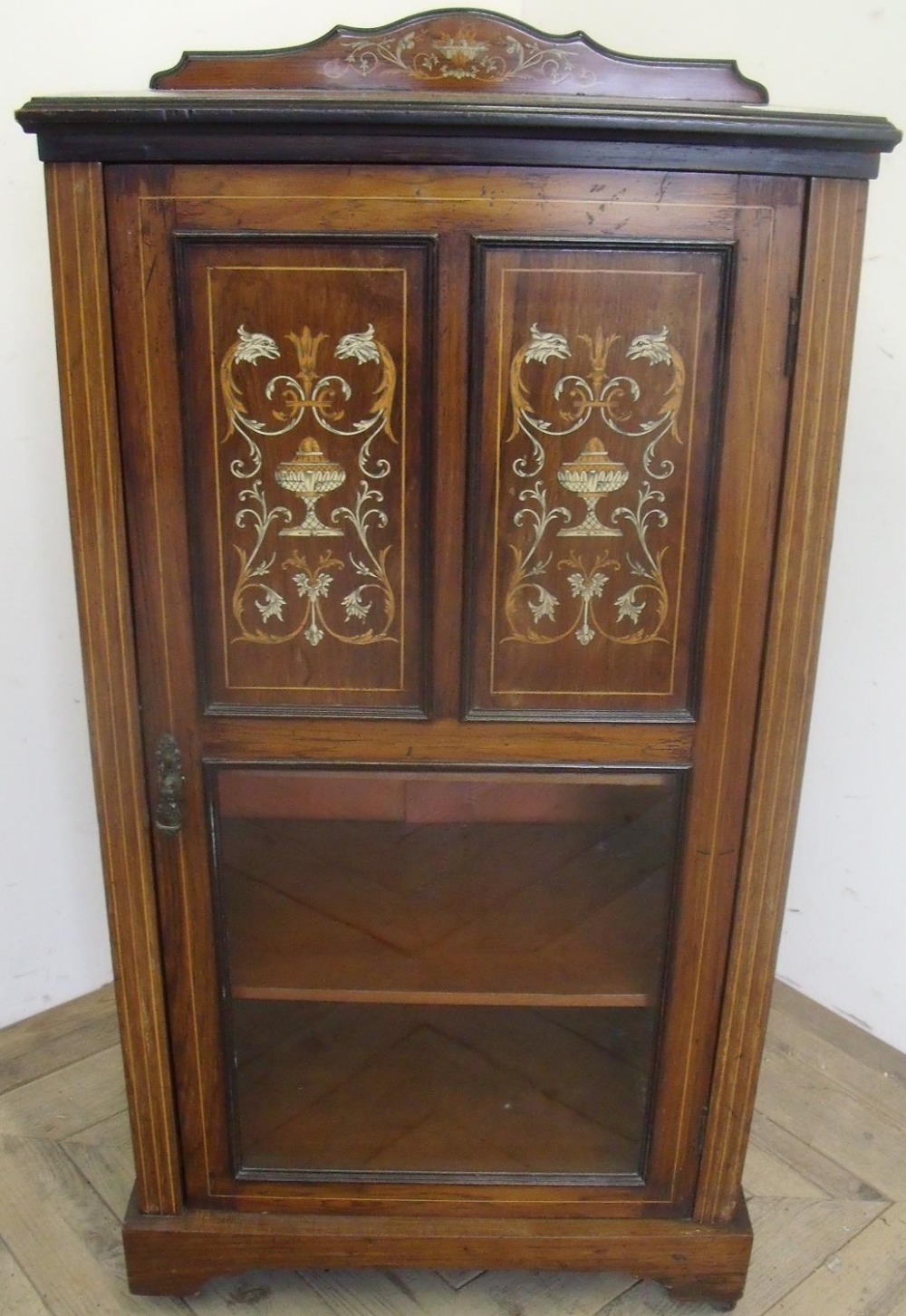 Victorian rosewood inlaid cabinet enclosed by panelled and glazed single cupboard door (55cm x