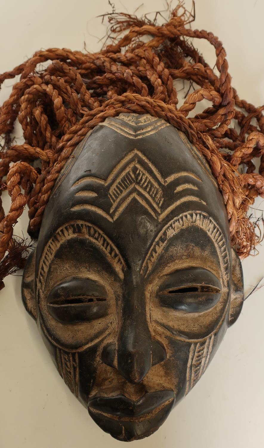 Carved African tribal style mask with hessian ropework hair