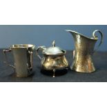 A small Birmingham 1918 silver hallmarked mustard pot with hinged top, a Birmingham 1907 cream jug