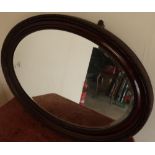 19th/20th C oval mahogany framed bevelled edge wall mirror