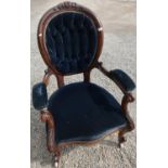 Victorian carved rosewood framed armchair with upholstered seat, back and arms