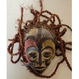 African tribal carved wood mask with hessian stringwork hair